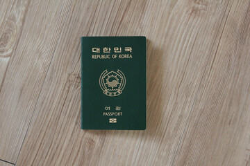 Republic of Korea passport on wooden texture
