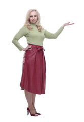 side view. attractive young woman pointing at a white screen