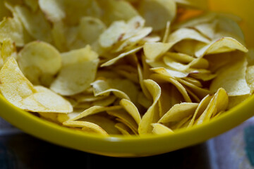 Potatoes fried chips in freeze motion, isolated