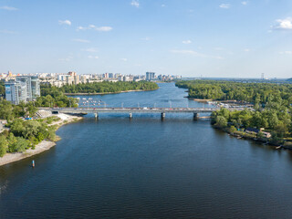 Obraz premium Aerial drone view. Automobile bridge over the Dnieper river in Kiev.