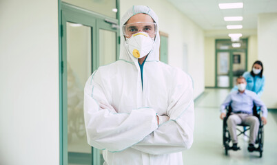 Obraz na płótnie Canvas Healthcare worker wearing PPE suit for working in hospital during the Covid-19 pandemic. Doctor in Safety costume