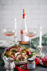 Prosciutto wrapped turkey roulade with pomergranate sauce. .style rustic.