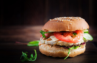 Big sandwich - hamburger burger with turkey meat,  tomato,  cucumber and lettuce.