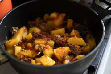 Sauce cooked in a saucepan over the fire