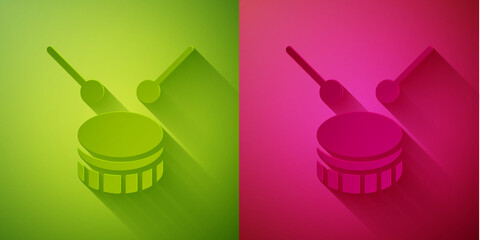 Paper cut Drum with drum sticks icon isolated on green and pink background. Music sign. Musical instrument symbol. Paper art style. Vector.