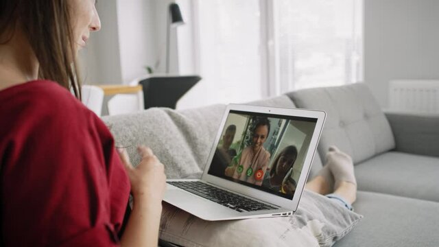 Side View Of Video Woman During Video Conference With Friends. Shot With RED Helium Camera In 8K.