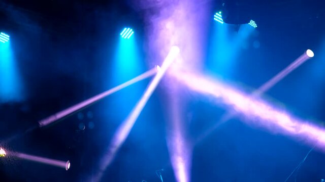 Stage colorful lighting beams spotlight and smoke of events show or concerts