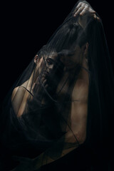 Skin. Graceful classic ballet dancers isolated on black studio background. Couple in minimalistic...