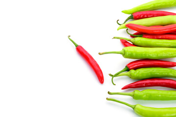 Fresh chilies are both red and green they are spicy, placed on a white background.