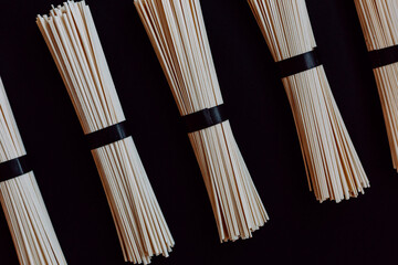 japanese udon noodles isolated on a black background