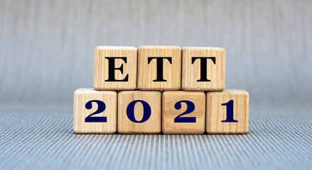 ETT 2021 - word on wooden cubes on a gray background