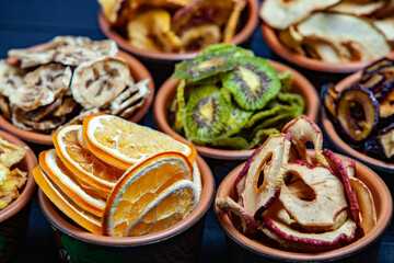 Organic Healthy Assorted Dried Fruit Mix close up. Dried fruit snacks. dried apples, mango, feijoa, dried apricots, prunes top view