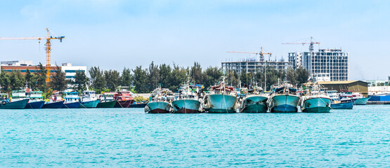 Fototapeta na wymiar Fishing ships in the Indian ocean near Male island, Maldives