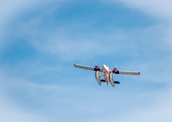 The plane in the blue sky
