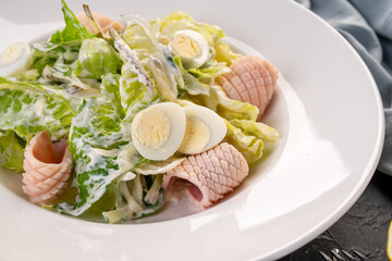salad with squid slices and egg. Seafood salad