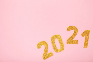 Happy New Year. Symbol from number 2021 on pink background.