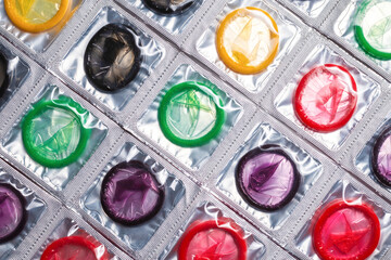 Colorful condoms background.