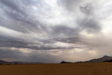 Thick cloud bank over the barren desert