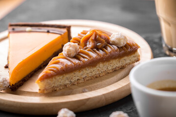 Caramel Pecan Tart slice dessert on black table at cafe