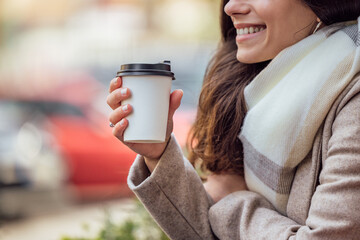 Female outside, blurred background.