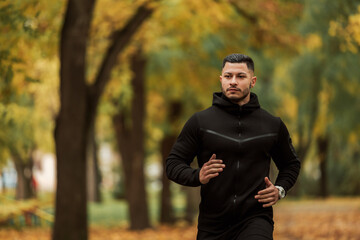 Trees in the background, jogging.