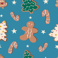 Cute Christmas vector seamless pattern with gingerbread man, stars, bell, fir trees and candy cane cookies on blue background. Winter holidays, sweet, for kids, treats, new year, Christmas market