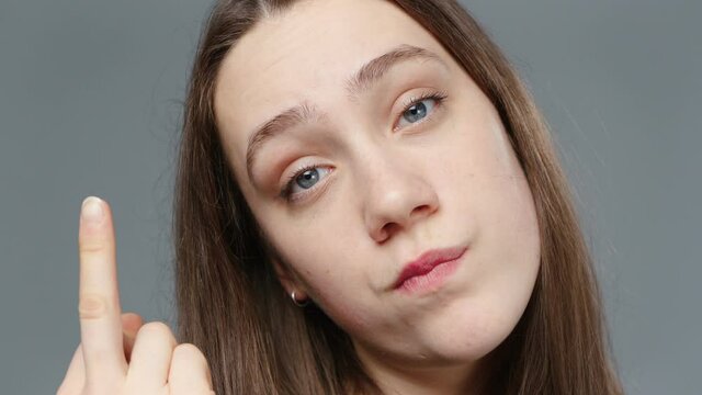 Video of young girl in black shirt with fuck finger, portrait
