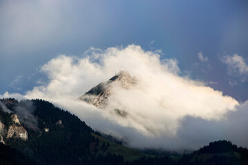 Bavarian mountain Wendelstein with fog in autumn