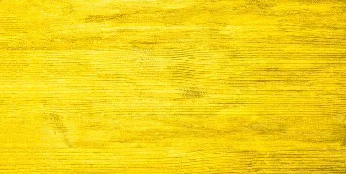 Wood yellow textured background in the trendy Mellow Yellow color. copy space