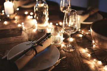Foto op Canvas Dining table decorated for an evening dinner party © Flamingo Images