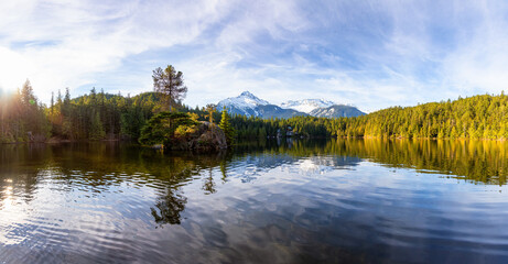 Beautiful Peaceful Panoramic View of Levette Lake with famous Tantalus Mountain Range in the background. Taken in Squamish, North of Vancouver, British Columbia, Canada. Nature Panorama