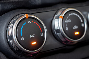 Air conditioning controls on the car dashboard. Close up car ventilation system, details of controls of modern car.