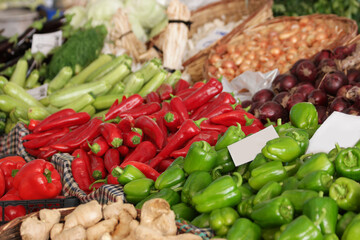 Fresh organic food at outdoors farmers market. Display of colorful peppers at vegetable shop. Organic food sales.