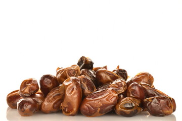 Several dried dates, close-up, isolated on white.