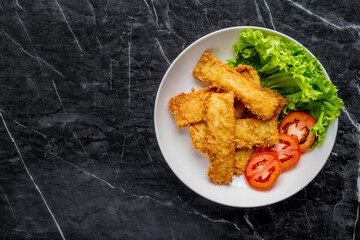 Breaded fried fish with vegetable