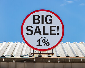 A Circle billboard with text shows BIG SALE is installed on a roof. Offer of promotion sales and...
