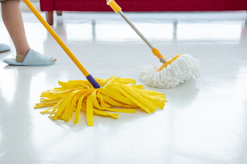 Two cleaners with mop cleaning marble floor outdoors. Cleaning service.