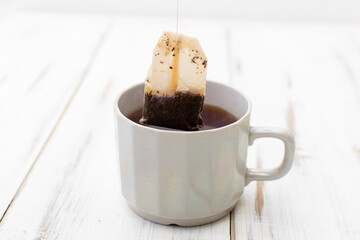 Tea in a cup with a disposable bag.