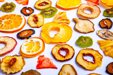 Organic Healthy Assorted Dried Fruit Mix close up. Dried fruit snacks. dried apples, mango, feijoa, dried apricots, prunes top view