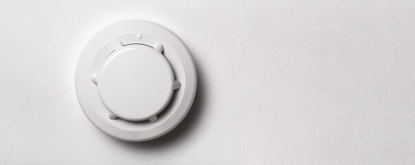Close-up Of White Smoke Detector On A Ceiling