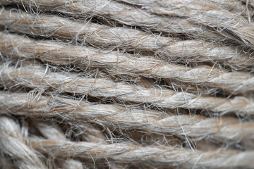 High-quality handmade coil made of natural hemp rope, isolated on a background. Rustic beige cord made of eco material