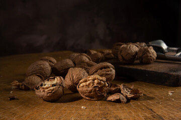 Nut, arrangement with nuts on rustic wood, low key image, selective focus.