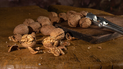 Nut, arrangement with nuts on rustic wood, low key image, selective focus.