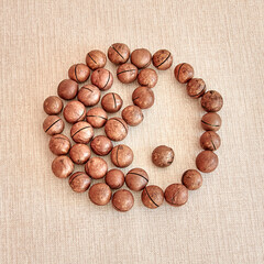 The male and female Yin-Yang symbol is made of macadamia nuts
