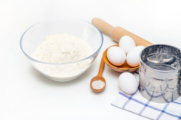 Fototapeta na wymiar Preparation of dough for home pancakes for Breakfast. Ingredients on the table wheat flour, eggs