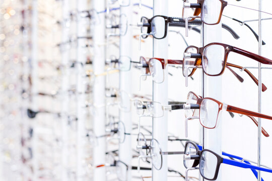 stand with eyeglasses in the store. the choice of spectacles for correction of vision © Elena