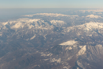 Angle view high above the mountains with snow.