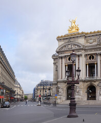  View of the Avenue de l Opera  with the Palais Garnier opera. On the street pedestrians and moving vehicles