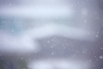 blurred background snowfall nature, abstract falling snowflakes design