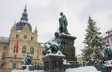 Main square Hauptplatz with Erzherzog Johann fountain and Town Hall in the background, in winter, in Graz, Styria region, Austria.